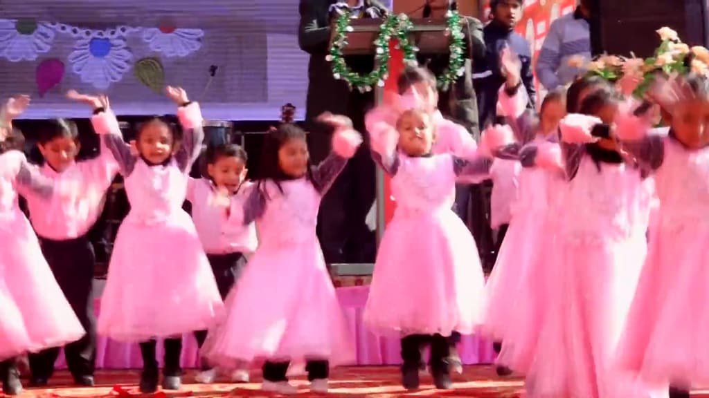 LKG children in pink dresses perform the welcome dance at the Annual Function