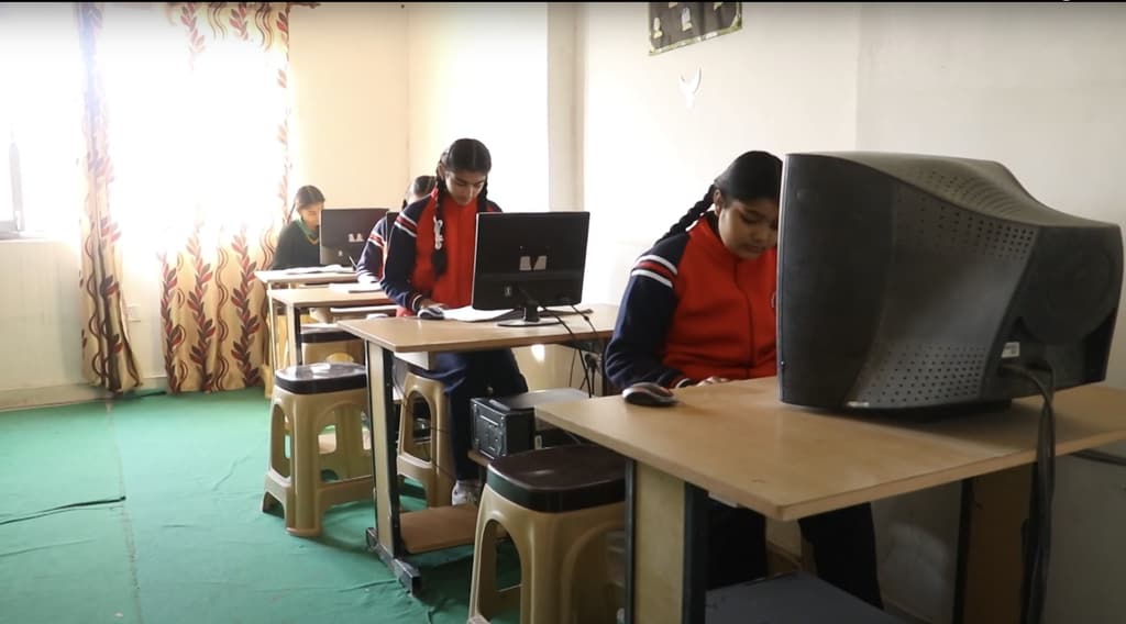 Students working at computers in the school computer lab