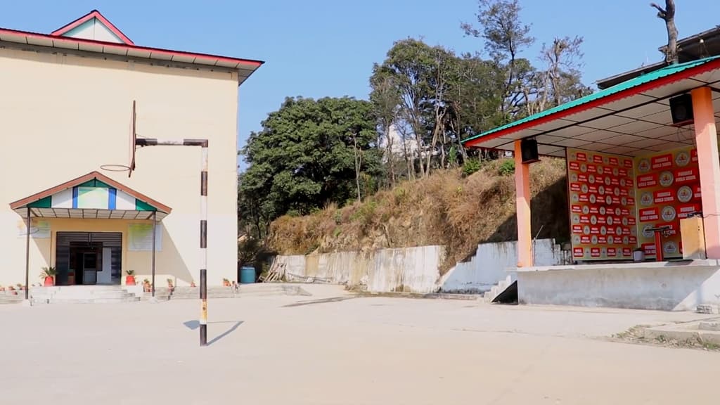 The main school building at Baroh, beside the covered assembly stage